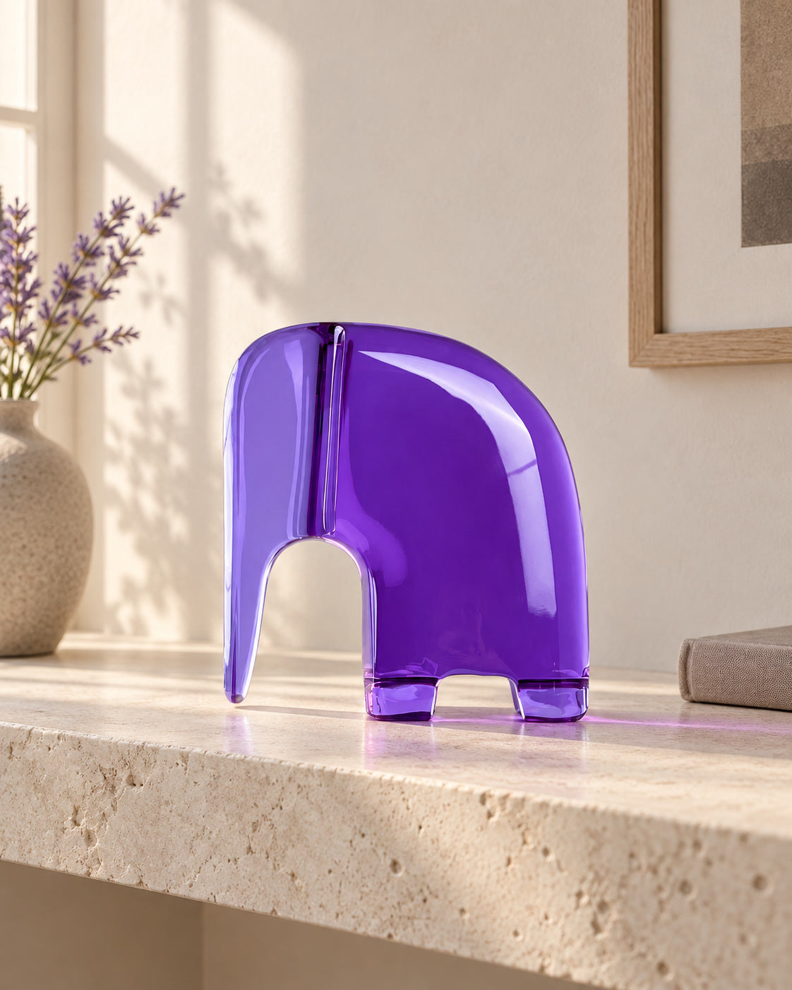 Still Elephant glass artwork in a quiet study